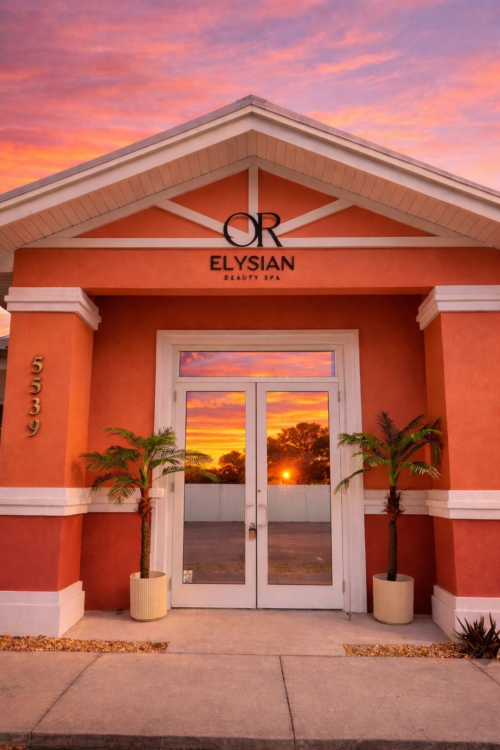 Orelysian Beauty Spa storefront at sunset in Sarasota